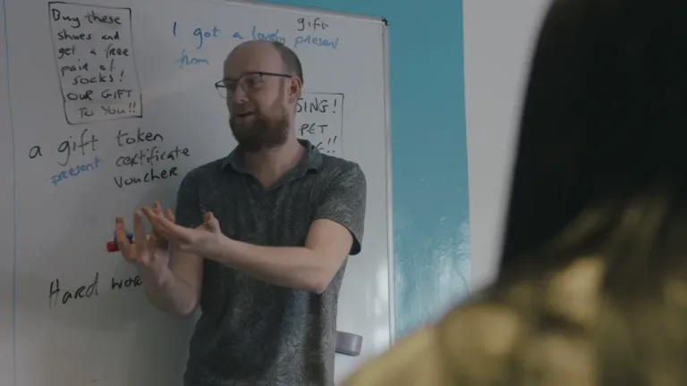 Teacher explaining Erasmus+