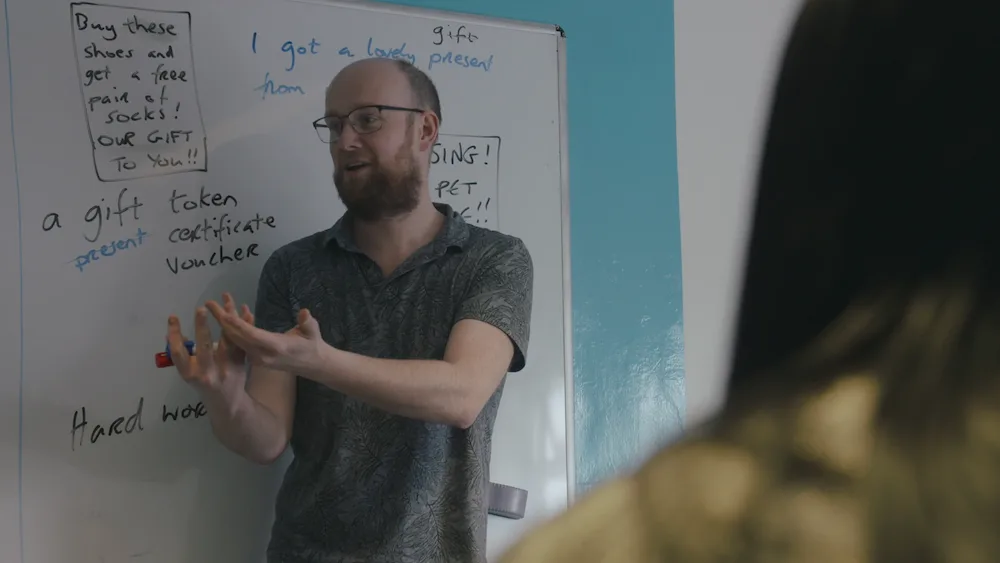 Teacher explaining Erasmus+