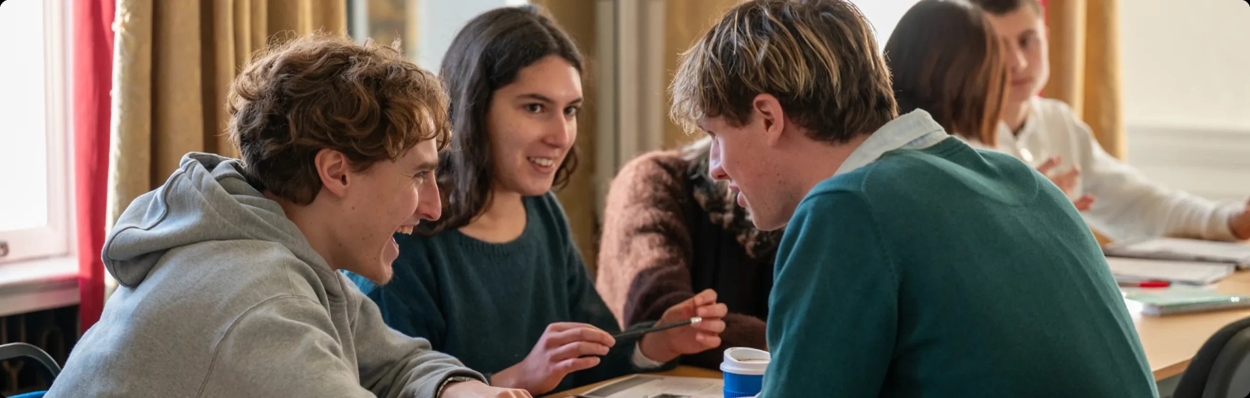Students comparing course options at Everest Language School