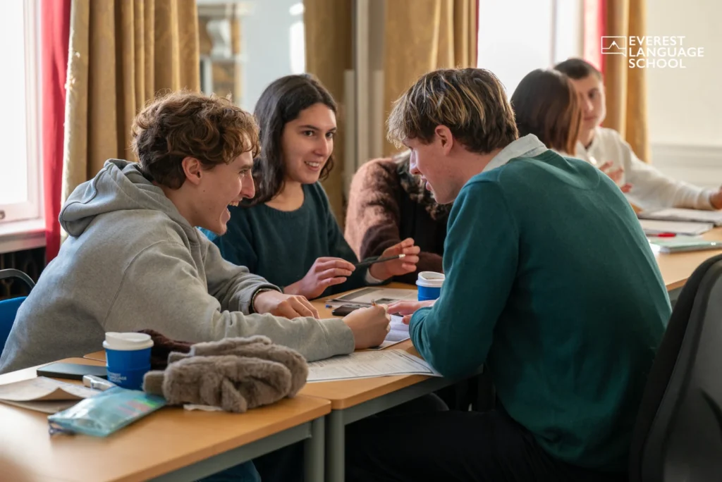 A teacher talking with students during a lesson