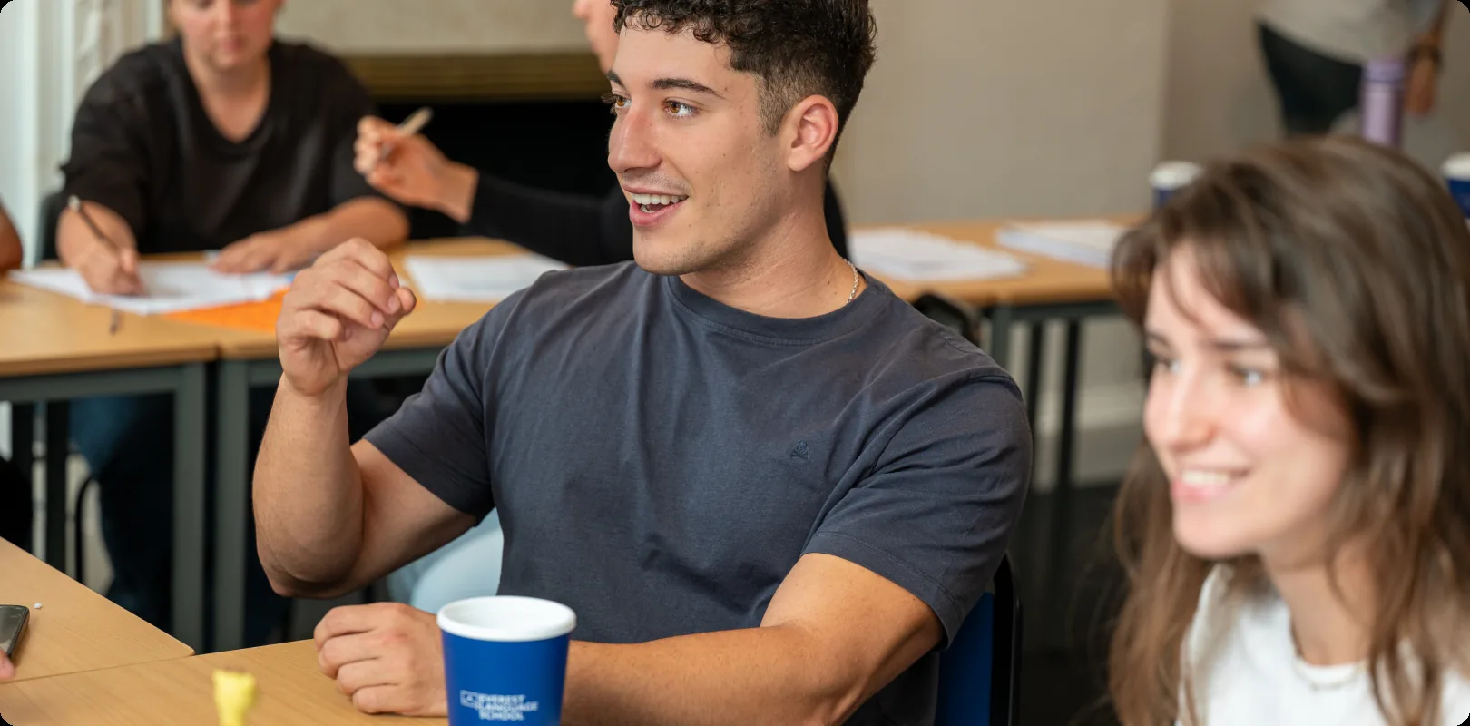 A teacher talking with two students